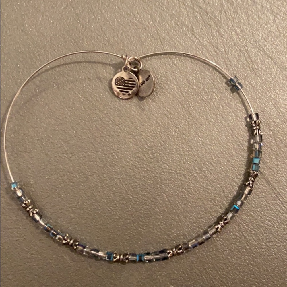 Alex and Ani bracelet with a Pandora charm